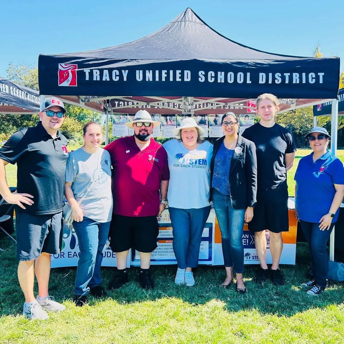 Tracy Unified School District staff standing in front of their STEM booth